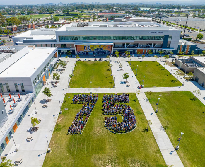 Aerial view of the faculty and staff form shape of 75 in the main quad.