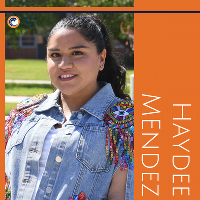 Student on campus, posing for their spotlight.