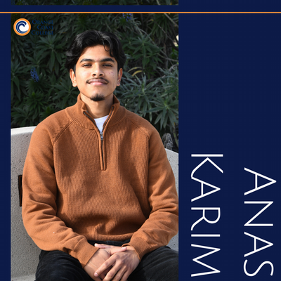 Anas sitting on a campus bench at OCC.