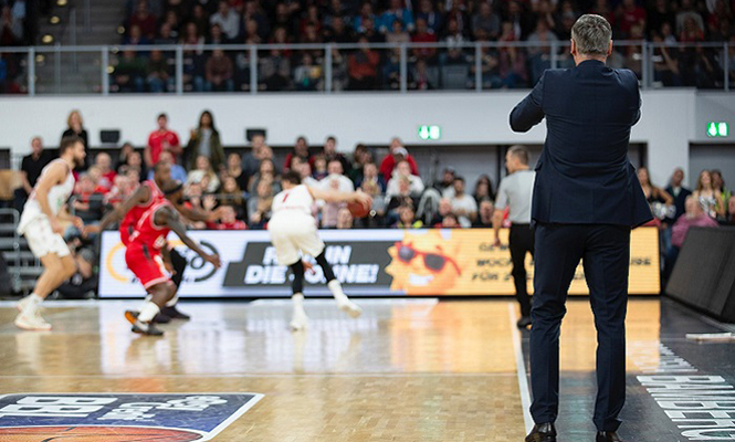 Basketball coach coaching during game