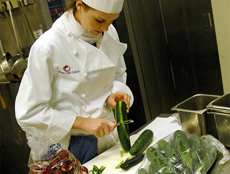 Chef peeling vegetables