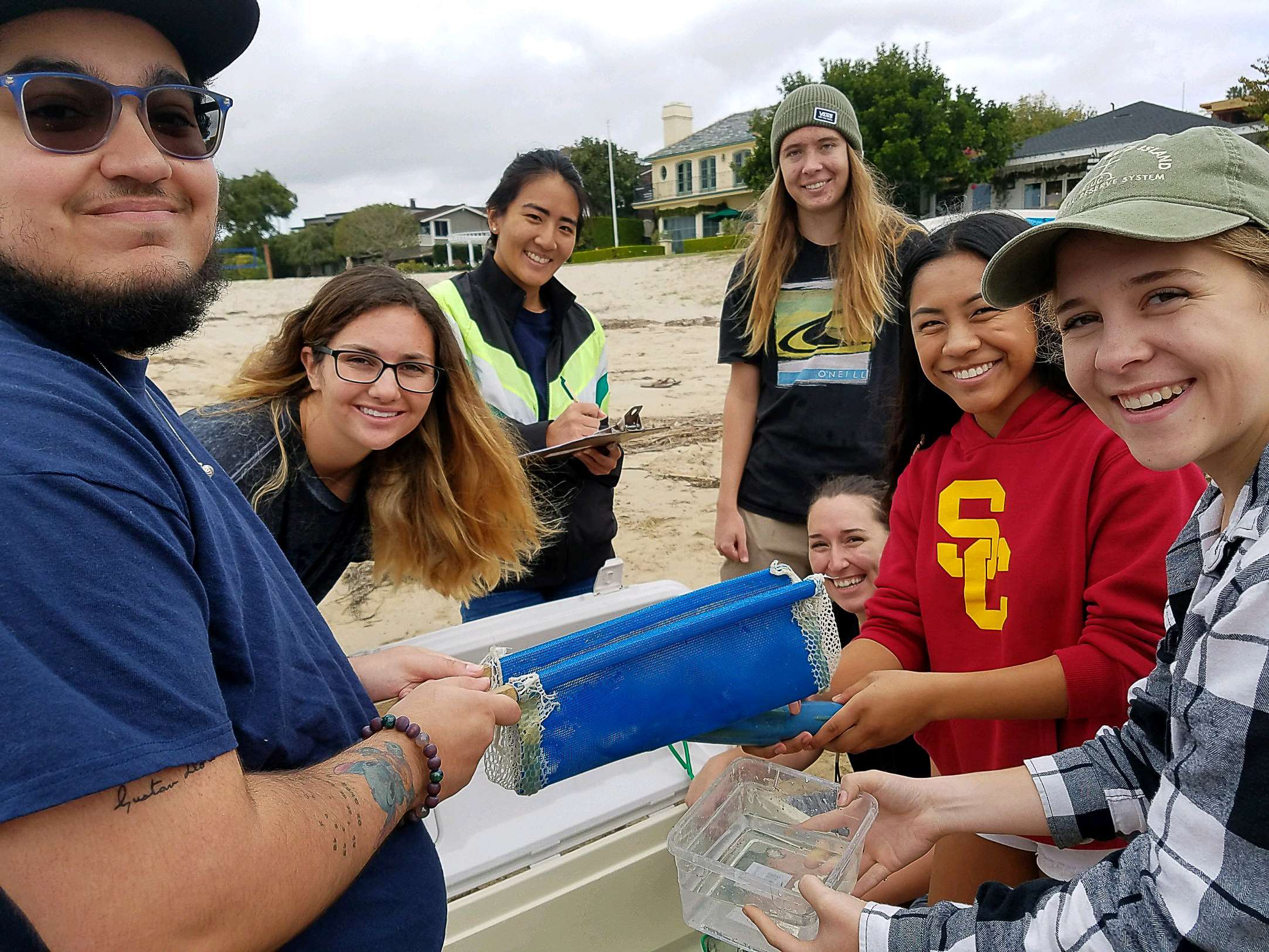 Students preparing to release white sea bass as part of a stock restoration program