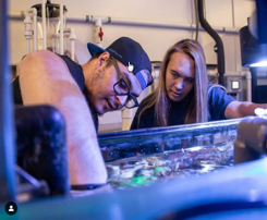 Students setting new coral frags into a system