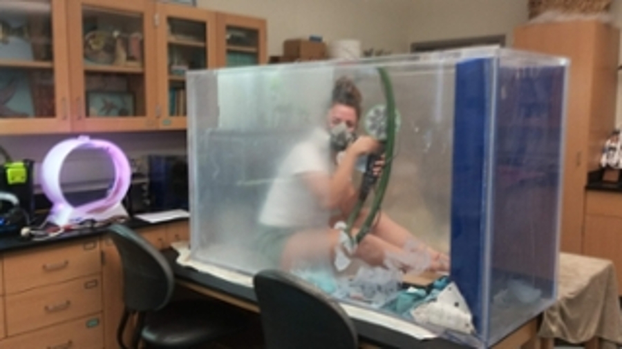 Student refinishing an acrylic aquarium