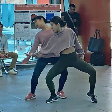 Two students dancing before an audience