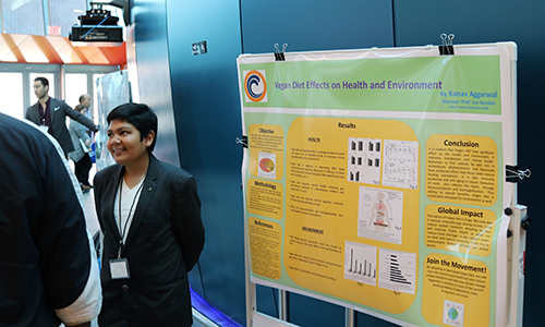 Student giving a poster presentation