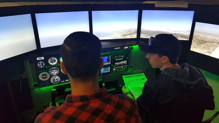 Students flying in the flight simulator.