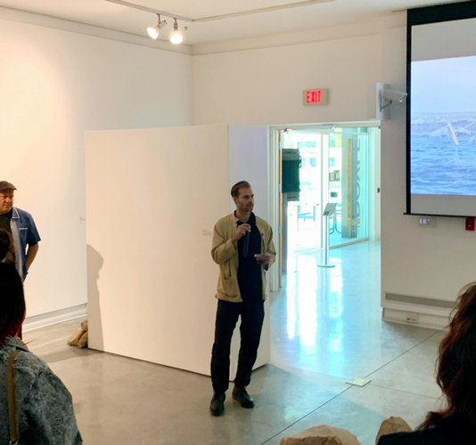 Monroe Isenberg giving artist talk