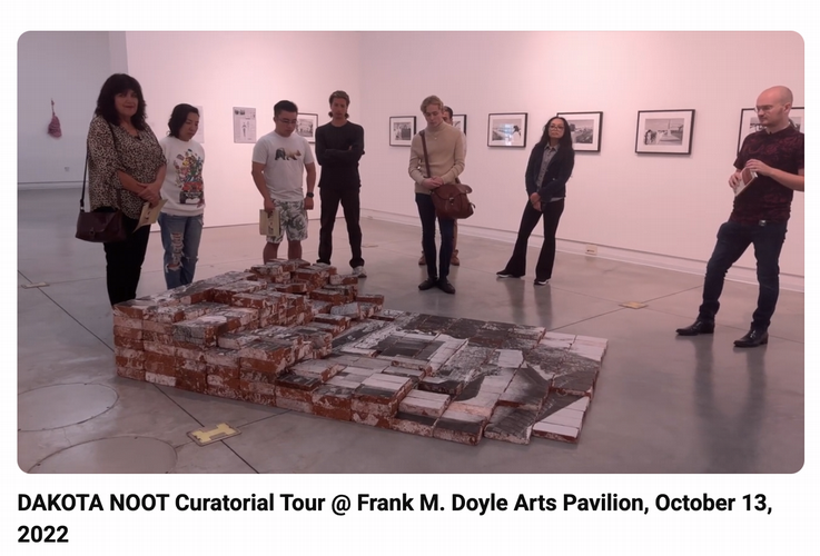 Curator Dakota Noot leading tour of exhibit