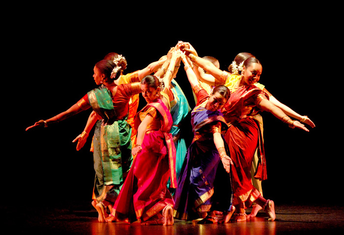 group of dancers from India close together joining hands