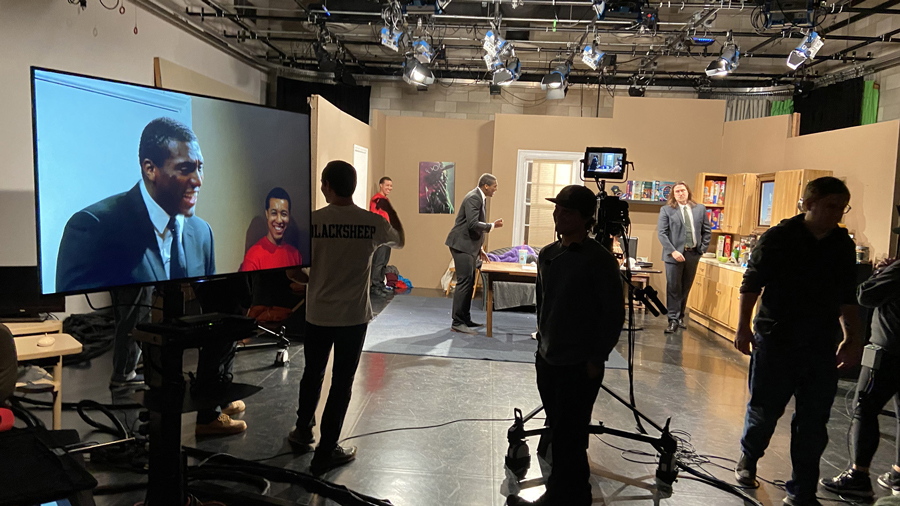 A student film crew in a television studio