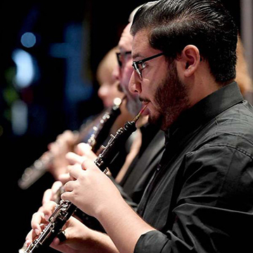 A student playing a oboe