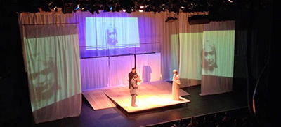 3 actors on stage viewed from above
