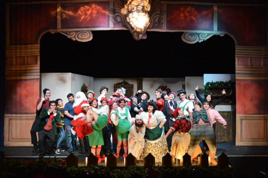 The cast of Christmas at the Lodge of the Slender Pine on stage