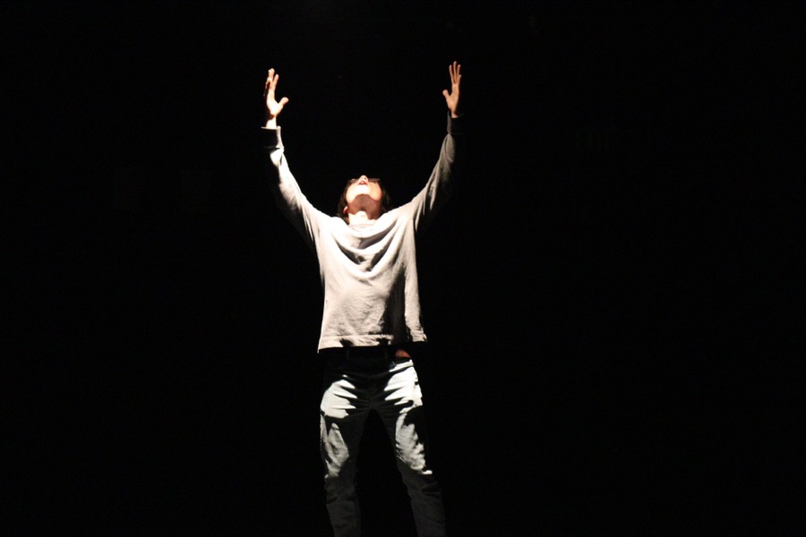 An actor raising his arms to the sky