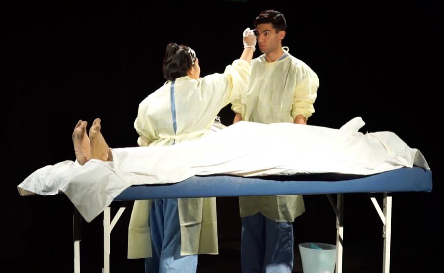2 actors dressed as surgeons