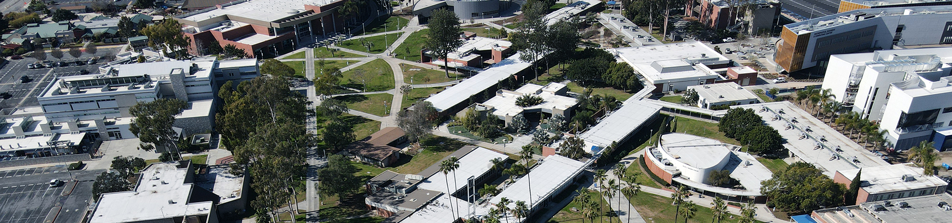 Aerial view of campus. Text: Adult Education