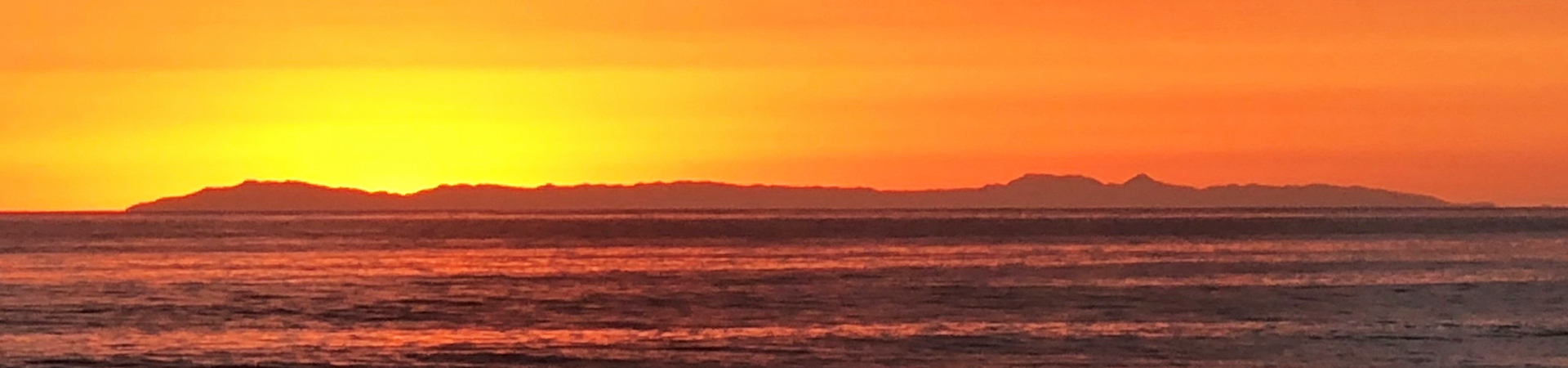 Catalina Island seen from afar at sunset.