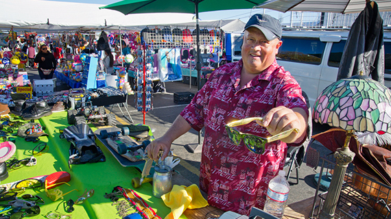 A vendor selling sunglasses