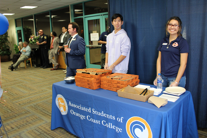 Advocacy Committee at event standing behind a table