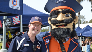 ASOCC director standing next to Mascot Pete the Pirate