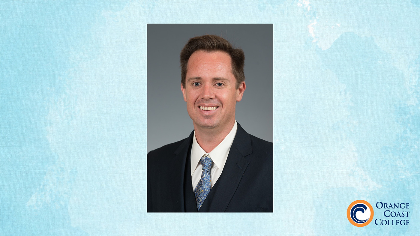 headshot photo of christaan desmond against light blue background with OCC logo in lower right corner