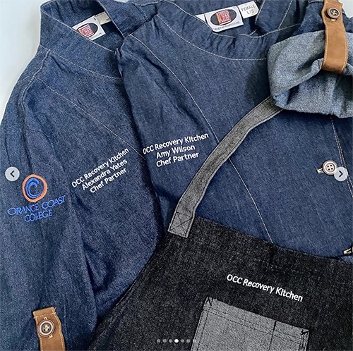 Uniforms placed on a table worn by the recovery kitchen team