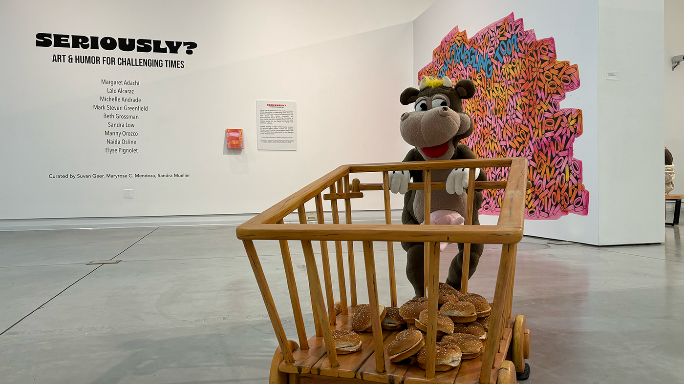 a wooden toy displayed in a museum, accompanied by a sign reading "seriously"