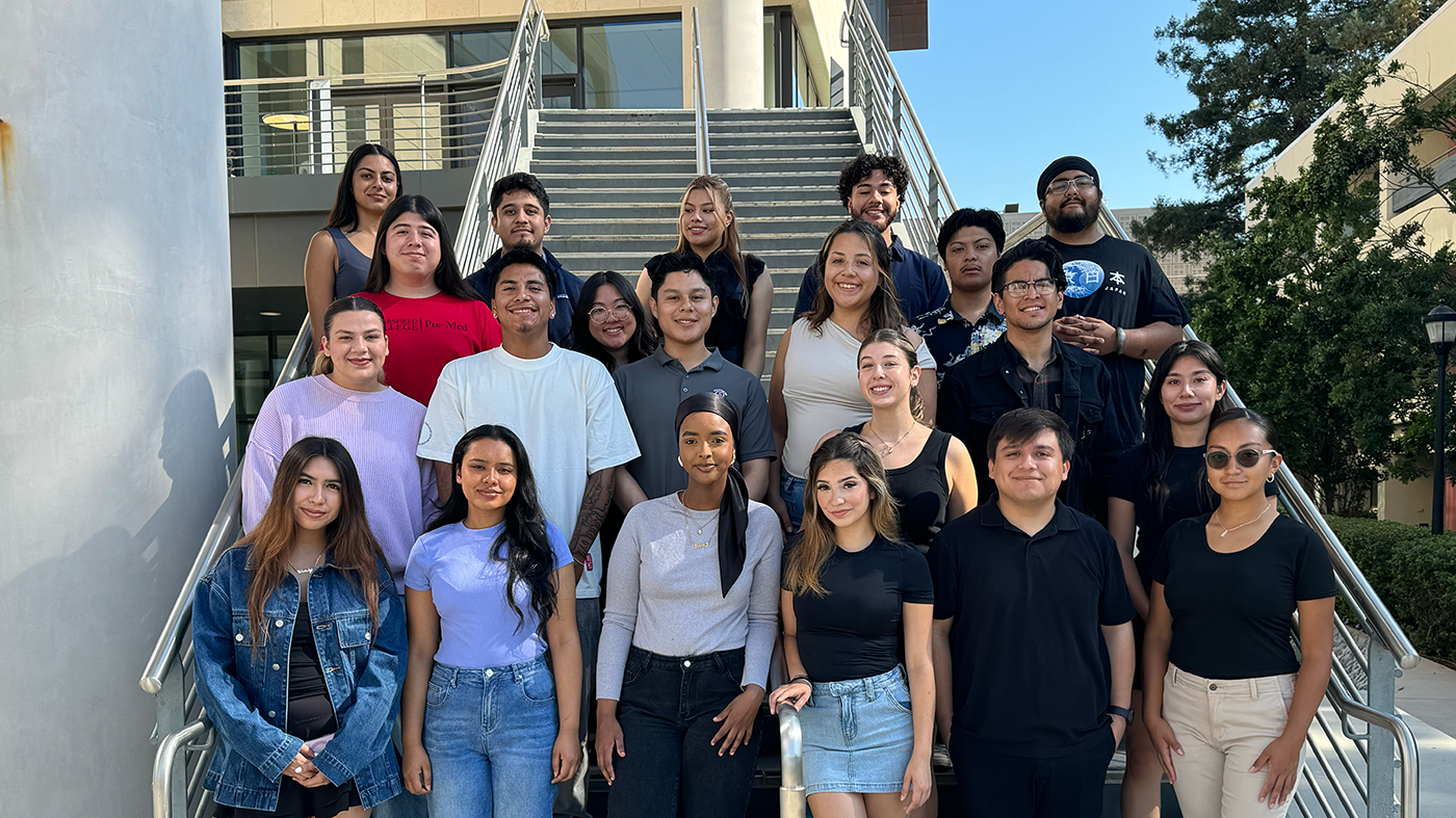 Group of students standing on a staircase