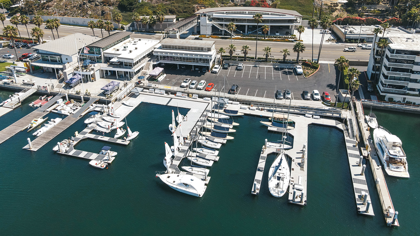 a marina with boats and parking lot