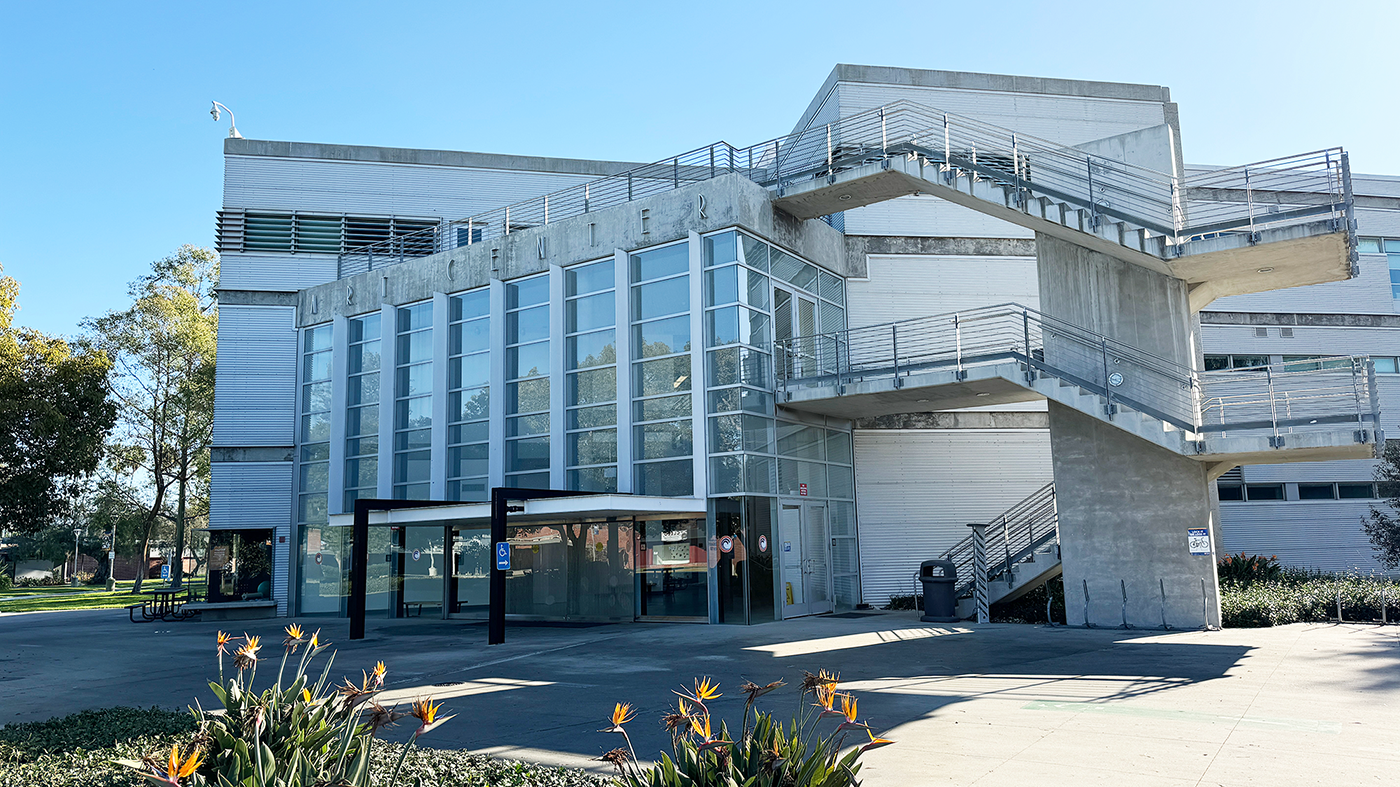 Three story building with a glass facade