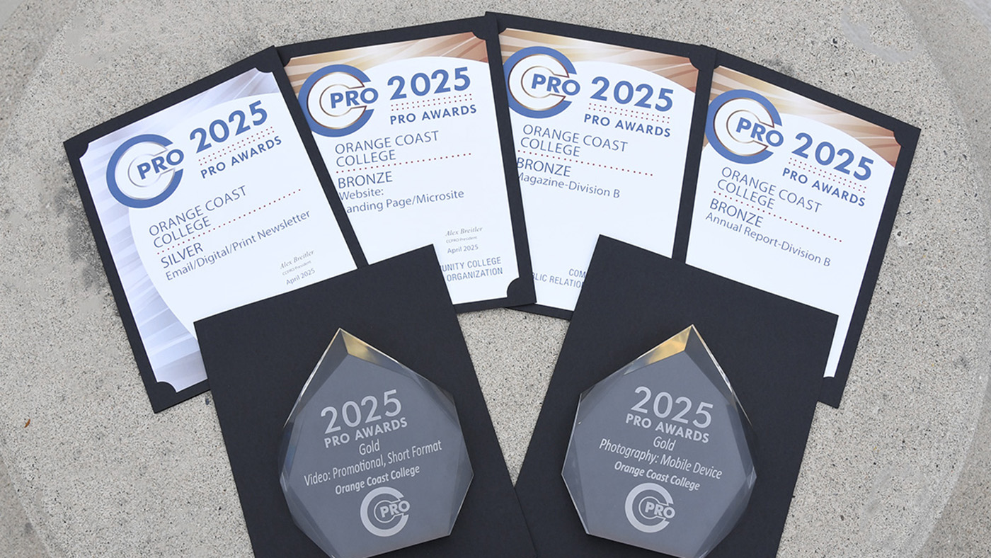 Three paper certificates and two glass awards