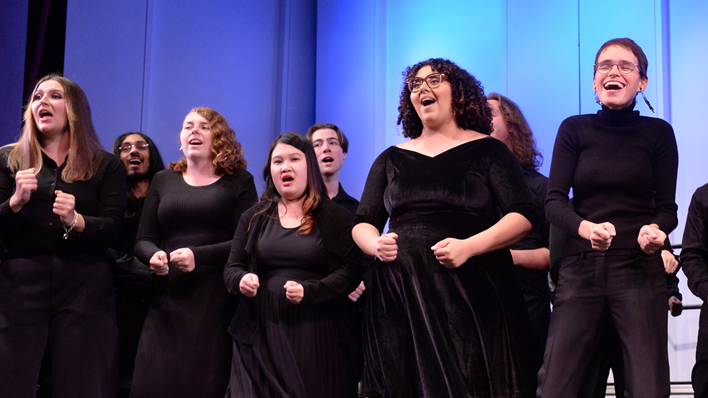 People on stage singing