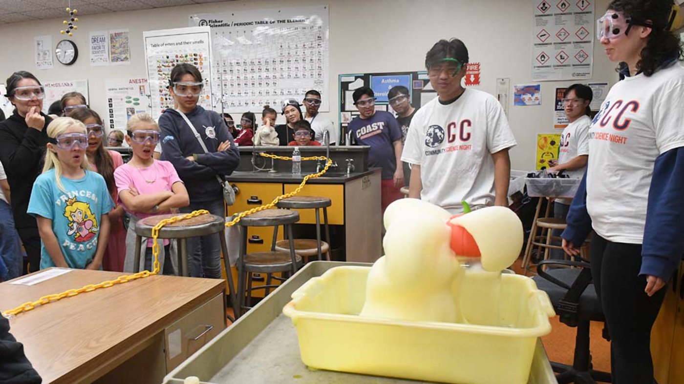 People with googles looking at a science experiment