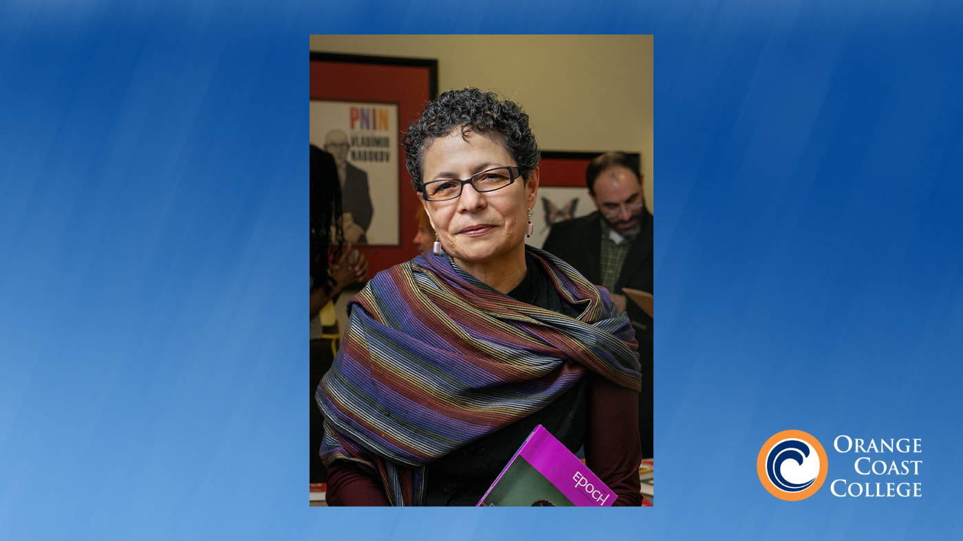 Viramontes Helena Maria holding a book. Photo credit: Lindsay France, Cornell University