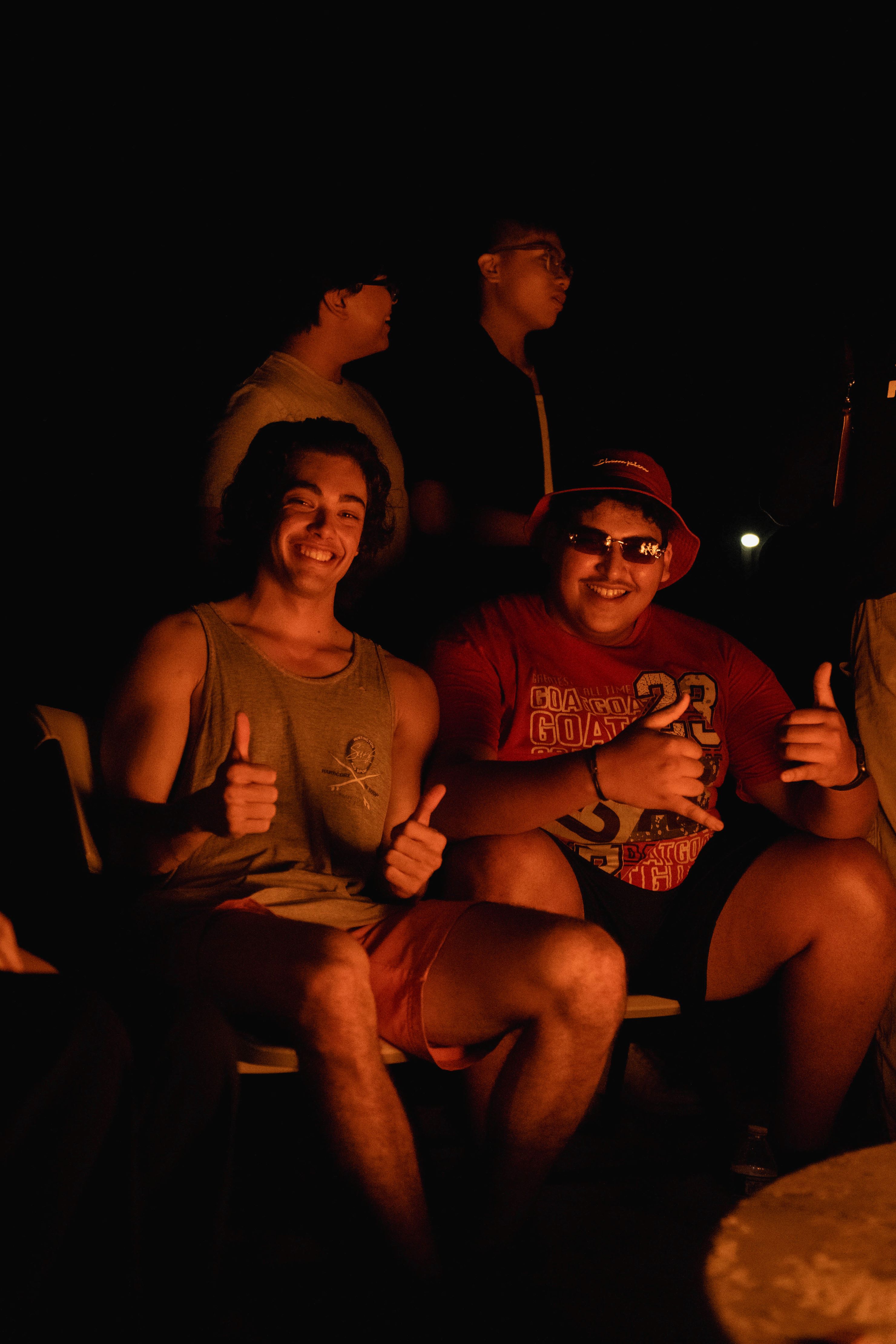 Two students sitting by the fire