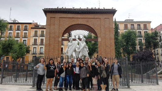 Group of students with professor in front of Playa Dos De Mayo