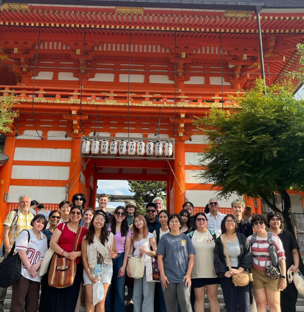 students standing in front of the monuments