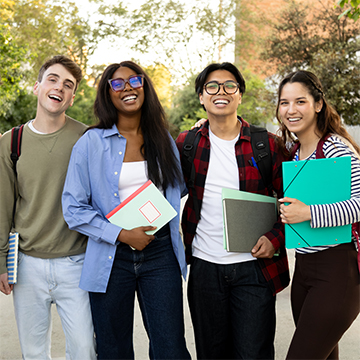 4 students standing close together.