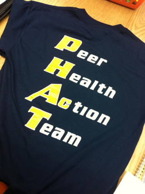 T-Shirt with text - Peer, Health, Action, Team
